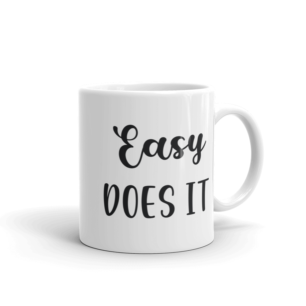 white ceramic coffee mug easy does it saying 11 and 15 ounce