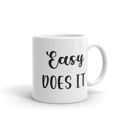 white ceramic coffee mug easy does it saying 11 and 15 ounce