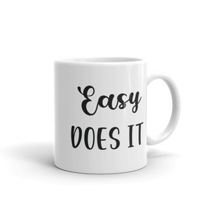 white ceramic coffee mug easy does it saying 11 and 15 ounce