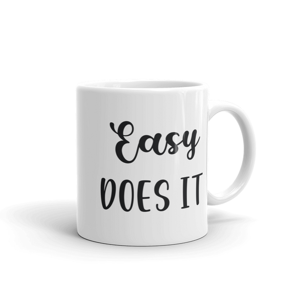 white ceramic coffee mug easy does it saying 11 and 15 ounce