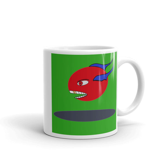 white ceramic mug 11 and 15 oz printed both sides red fish-like creature large white teeth one gold tooth large eye red pupil blue fins green background surreal cartoon image